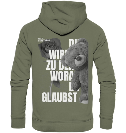 "Du wirdst zu den woran du glaubst" Mace Optimismus - Premium Unisex Hoodie